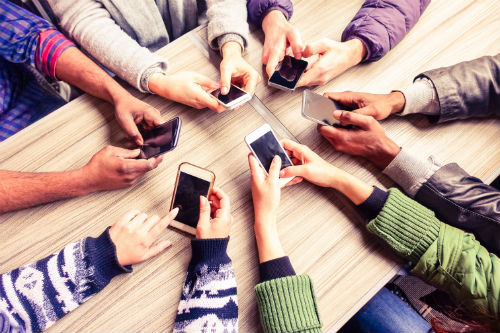 Group of People with Phone Having a Good Mobile User Experience