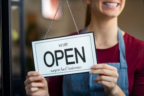 small business owner opening her shop