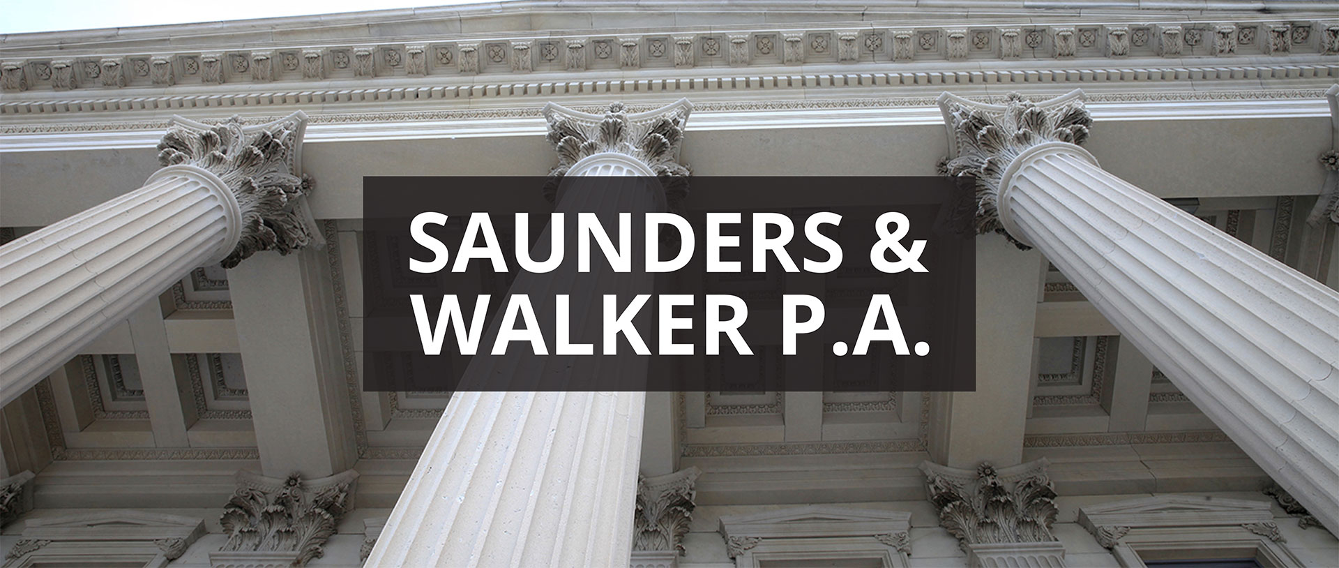 Ornate classical building columns with Corinthian capitals and "Saunders & Walker P.A." text overlay representing a law firm or professional services company.